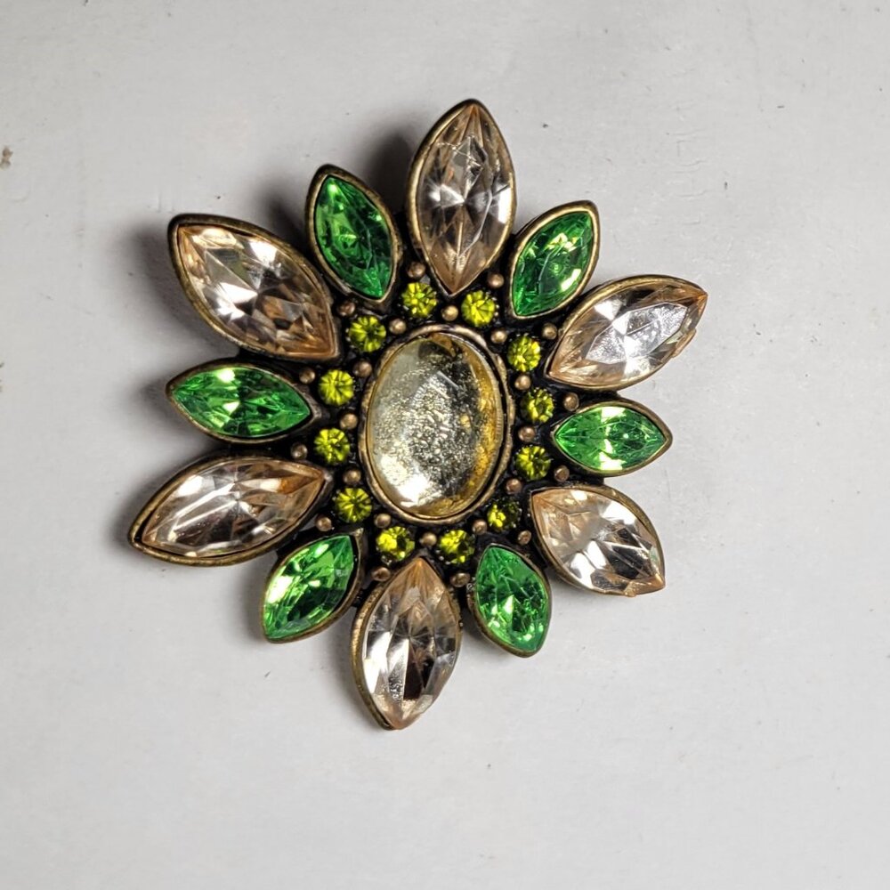 Vintage-looking pin brooch with green, pink and white rhinestones